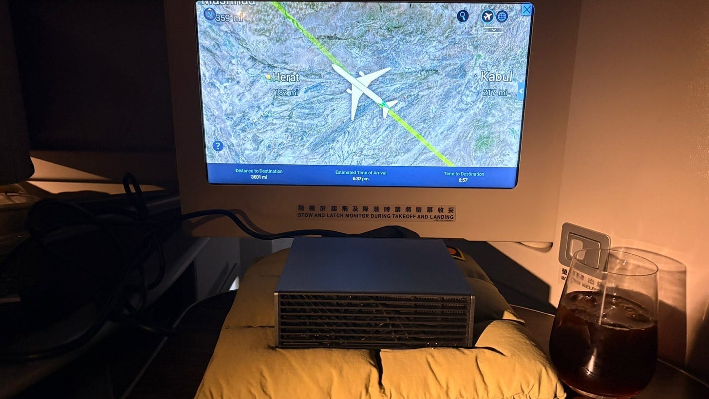 “Stow and latch monitor during takeoff and landing” Airline seat-back sign: “Stow and latch monitor during takeoff and landing”